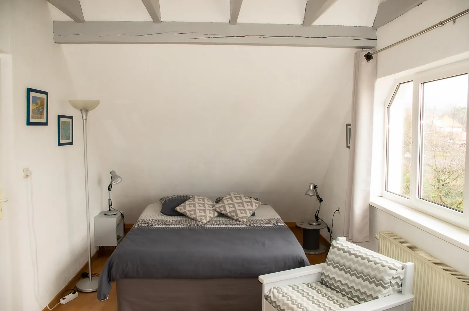 Chambre à coucher de la Chambre d'hôtes Les lilas à Molsheim